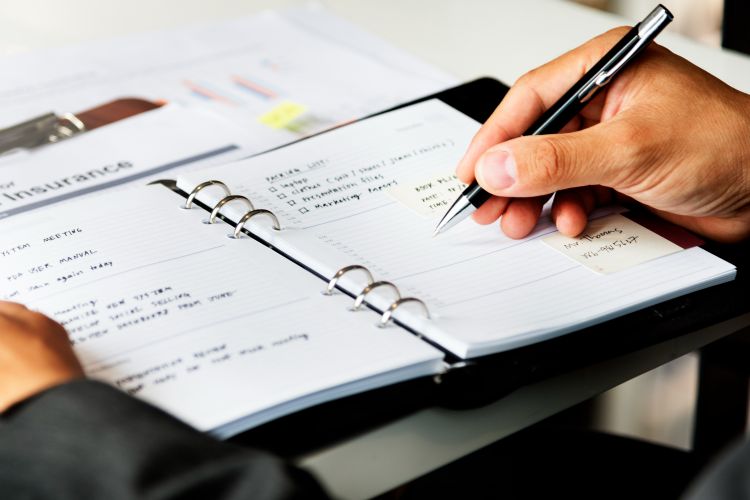 scheduling neurofeedback training course into her planner
